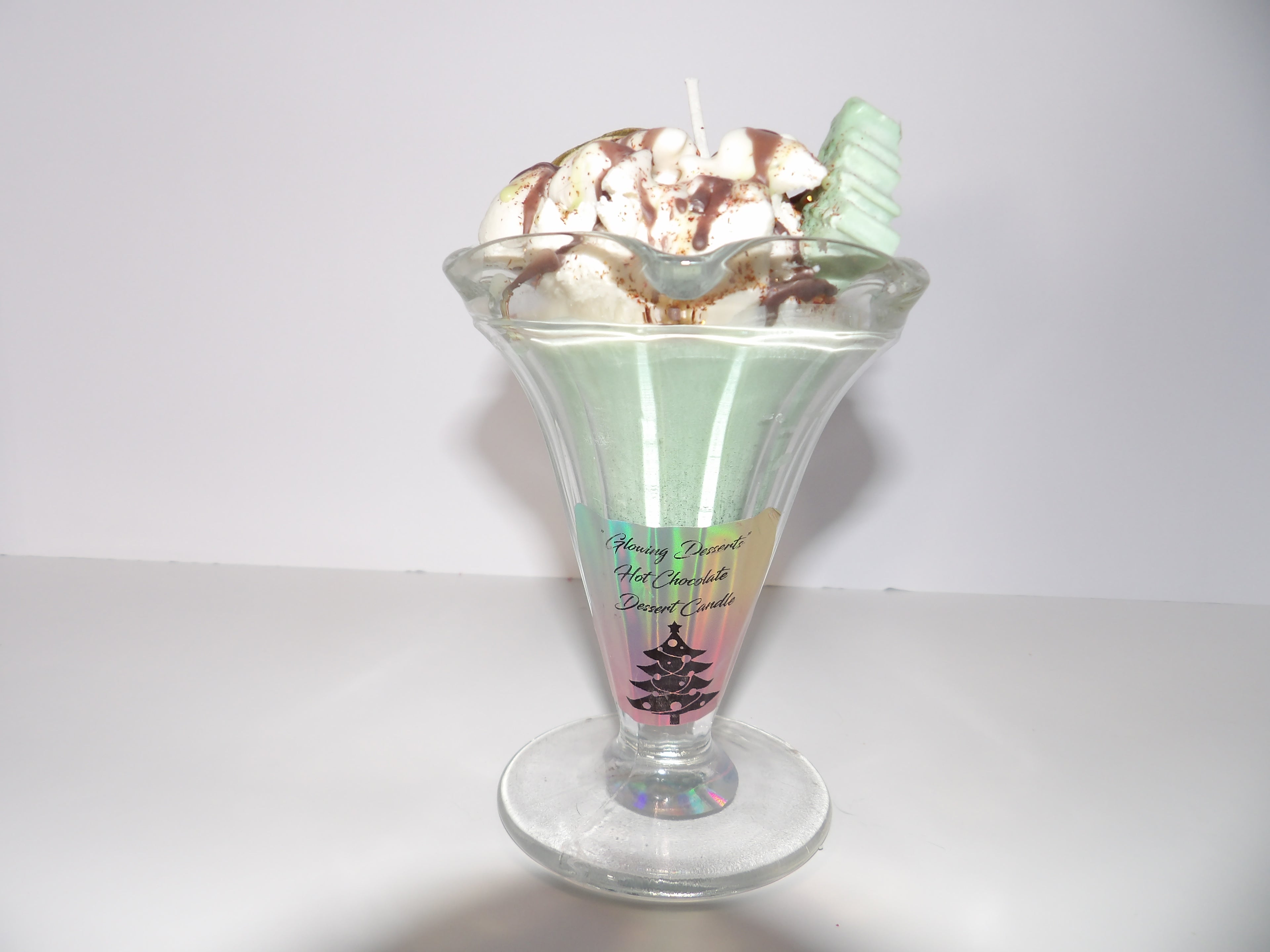 Peppermint Patty Dessert Candle with garnish,a cute little Christmas tree and chocolate topping.