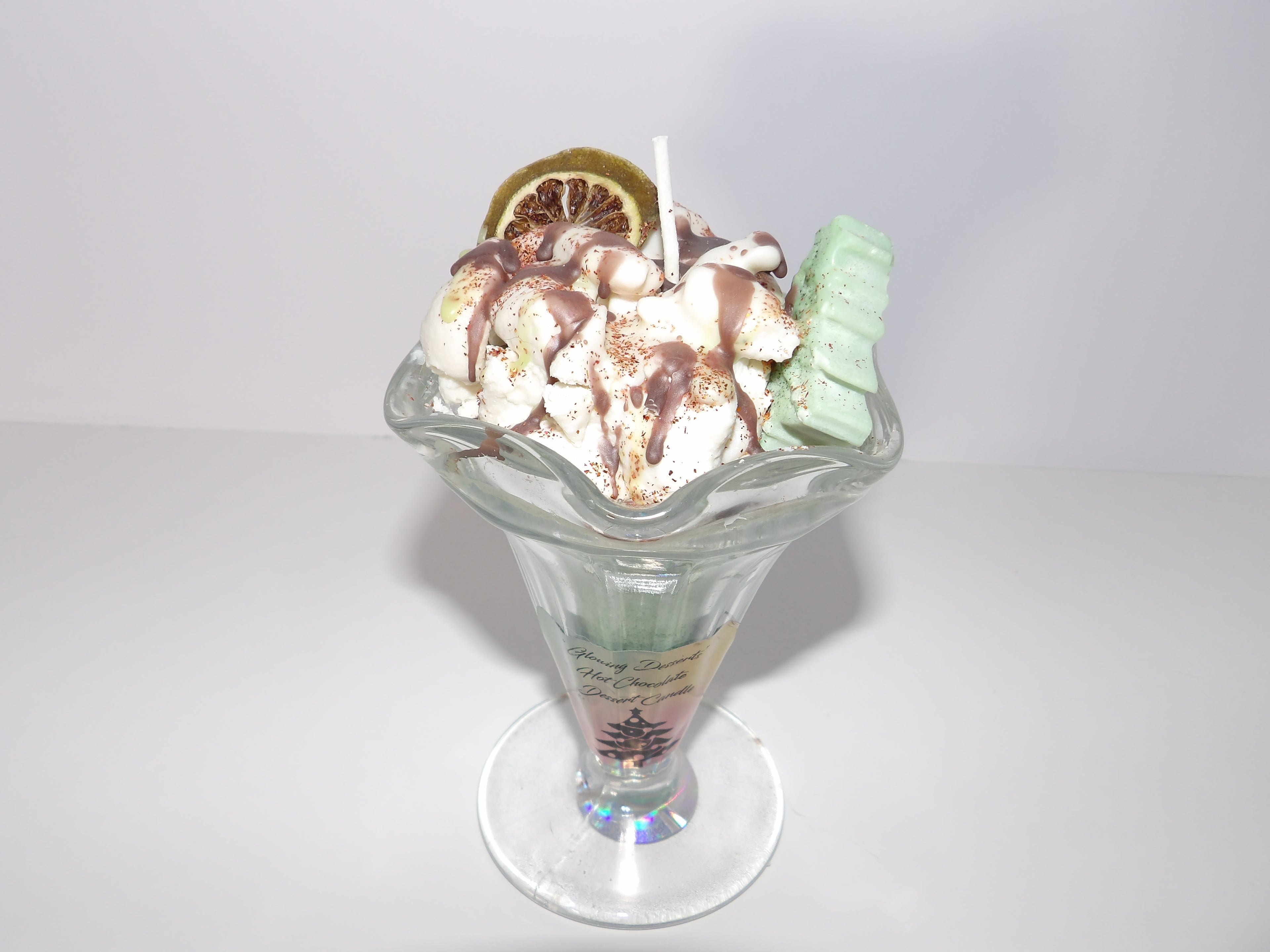 Peppermint Patty Dessert Candle with garnish,a cute little Christmas tree and chocolate topping.